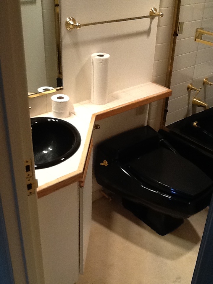 Original Bathroom featured black plumbing fixtures, tile countertop and carpet floors