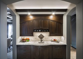 Gilmans Kitchens and Baths Dark Brown Kitchen Cabinets and Light Countertop