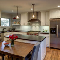 White Kitchen Cabinets and Metal Hood