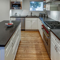 White Traditional Kitchen Cabinets with Metal Handles