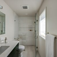 Black Bathroom Cabinets and White Vanity