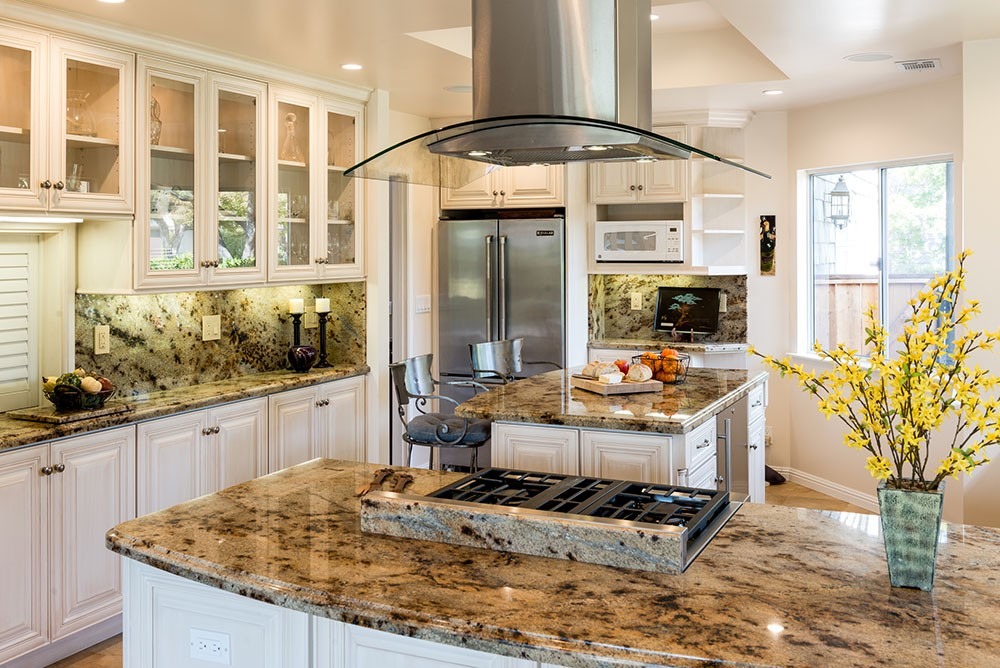 A Kitchen with Granite Countertops and Backsplash